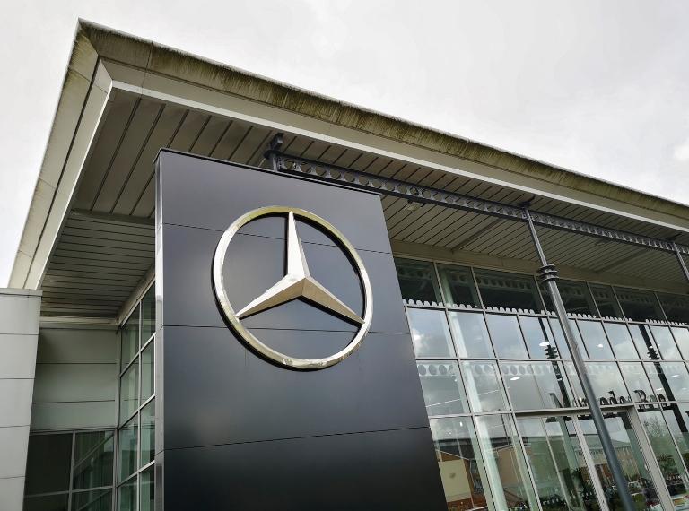 Mercedes showroom with logo. Mercedes-Benz, commonly referred to as Mercedes is known for producing luxury vehicles and commercial vehicles. The headquarters is in Stuttgart, Baden-Württemberg.