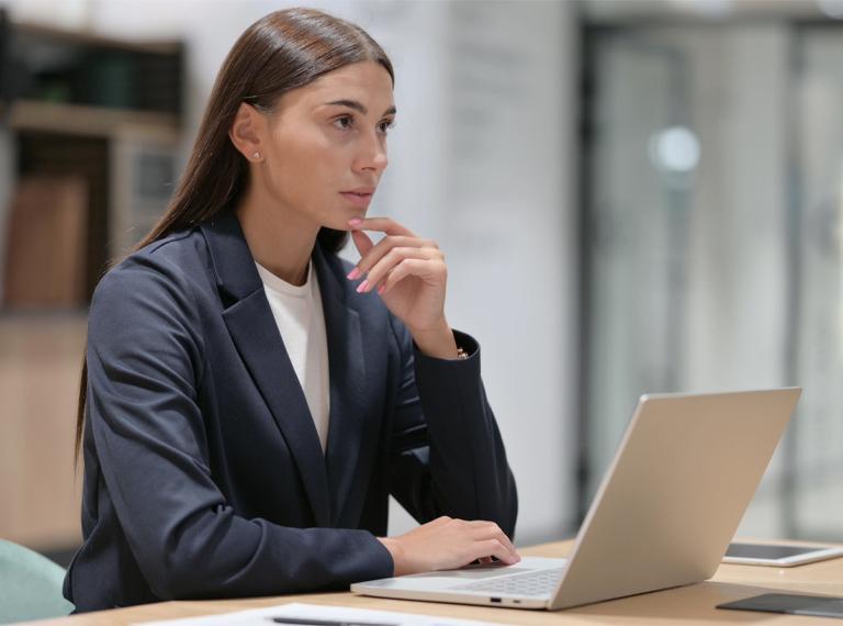 Thinking Latin Businesswoman Working in Office.