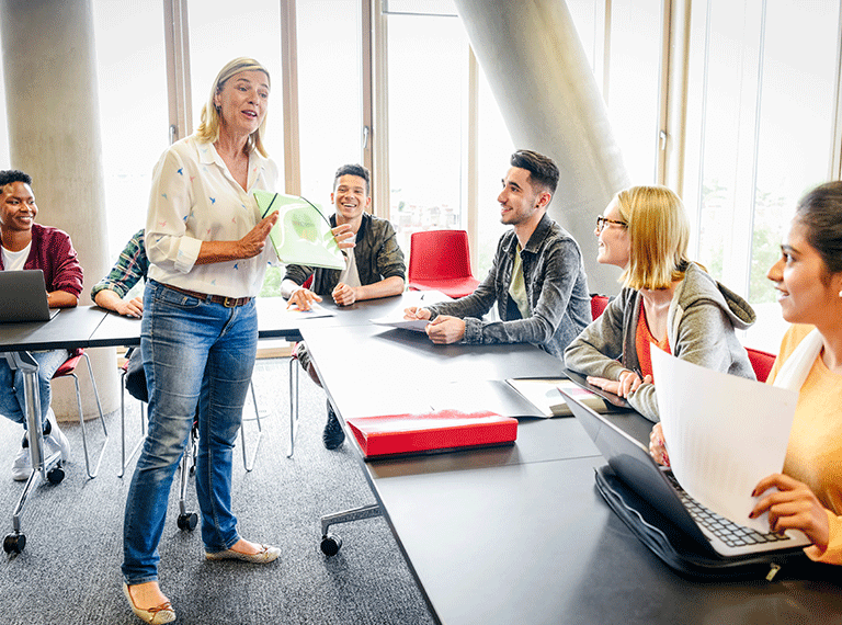Professional in meeting room doing an employability session with students
