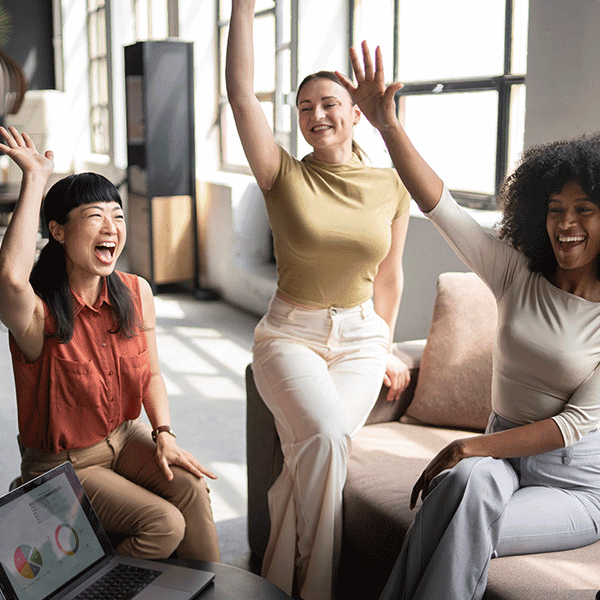 Team of Gen Z workers celebrate their achievements