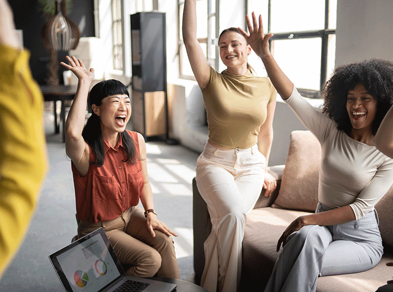 Gen Z in office celebrating a win