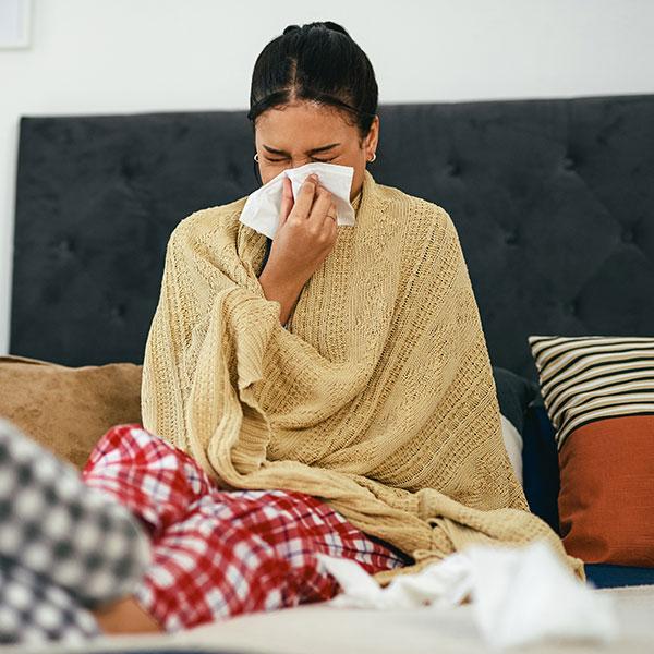 Sick employee in bed with flu