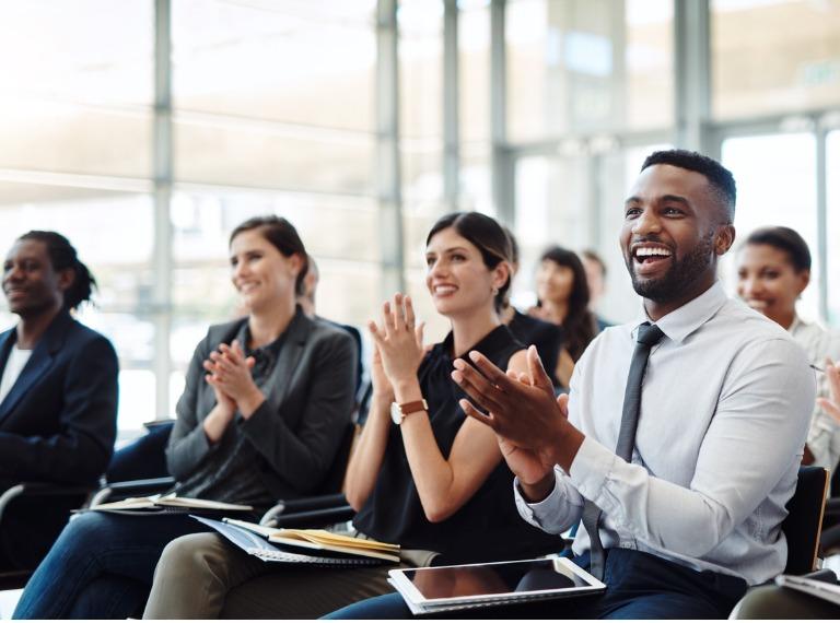 Office workers applauding